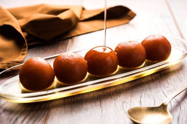 Gulab jamun /gulaab jamun is a milk-solid-based Indian sweet made in festival or wedding party clipart