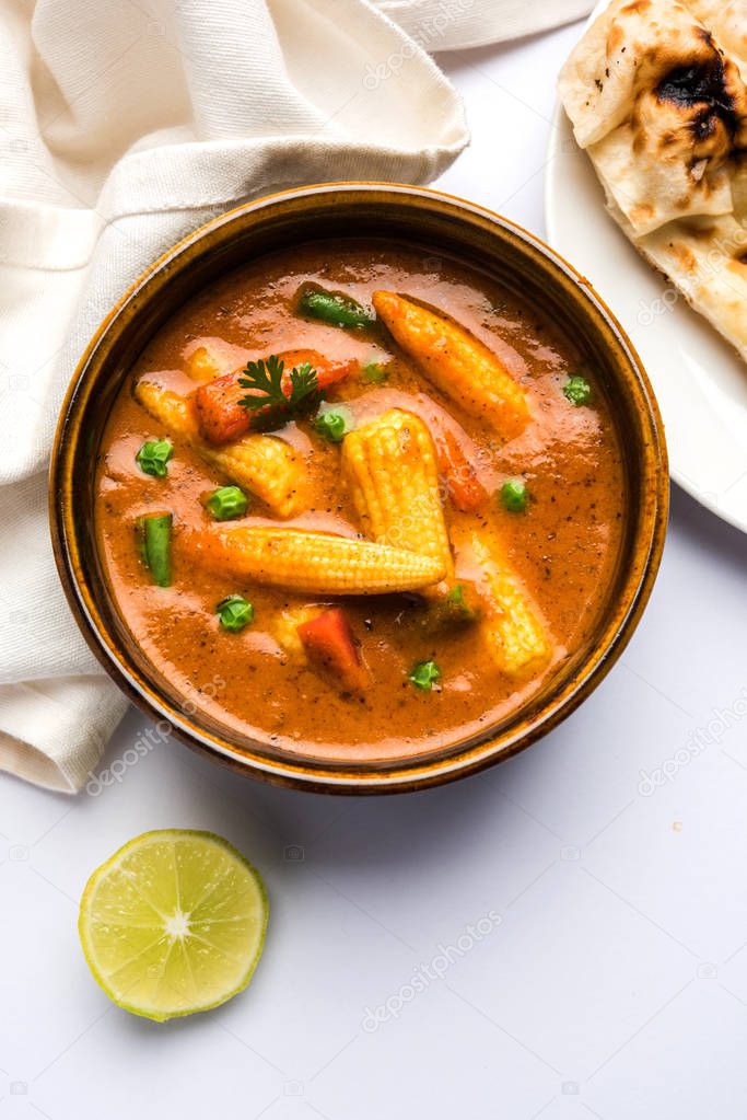 Indian Baby Corn Masala or spicy Baby corn curry served with roti or naan or indian bread