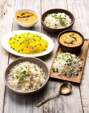 Grup fotoğrafı yeşil bezelye ve sarımsak ile Hint pirinç jeera dal fry, seçici odak ile görev yaptı.