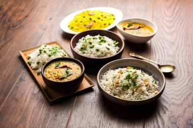 Grup fotoğrafı yeşil bezelye ve sarımsak ile Hint pirinç jeera dal fry, seçici odak ile görev yaptı.