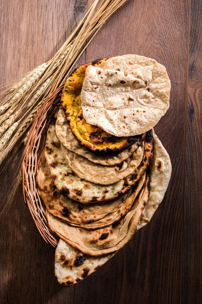 Assorted Indian Bread Basket includes chapati, tandoori roti or naan, paratha, kulcha, fulka, missi roti