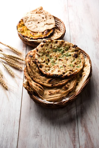 Assorted Indian Bread Basket includes chapati, tandoori roti or naan, paratha, kulcha, fulka, missi roti