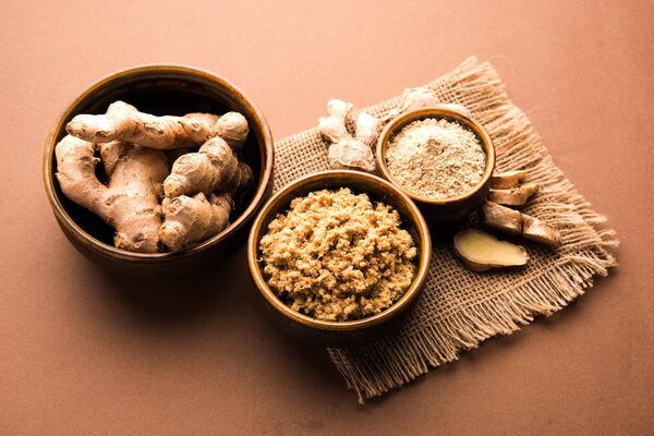 Ginger paste and powder also known as sunth / suntha / sonth with whole dried and fresh ginger, selective focus