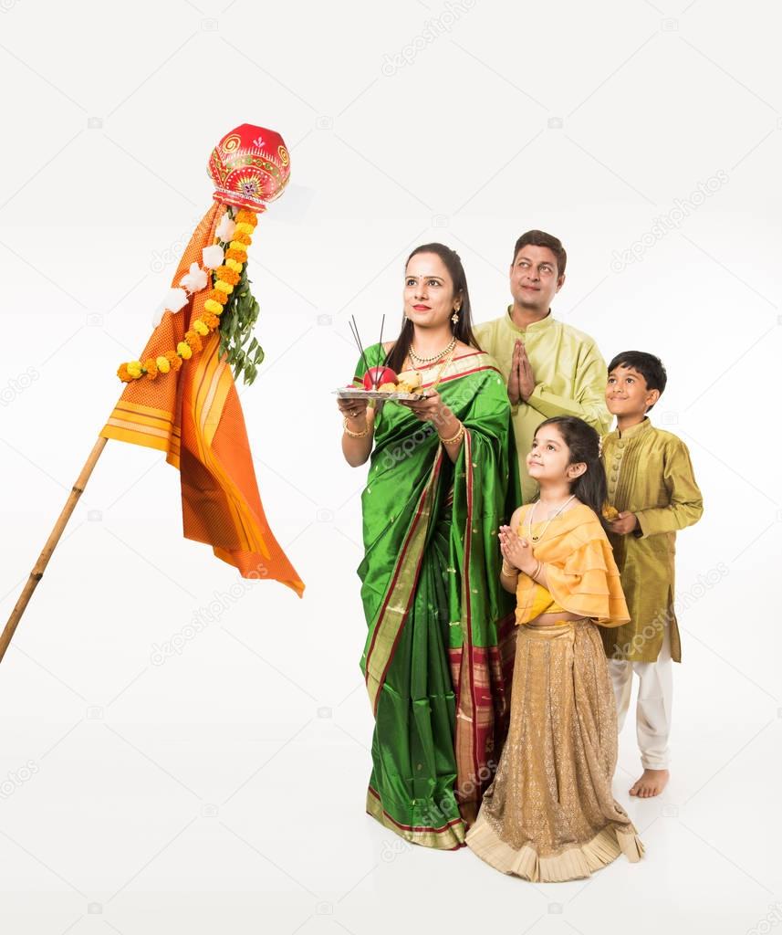Indian family celebrating Gudi Padwa or Ugadi festival, which is a new year in Hindu tradition