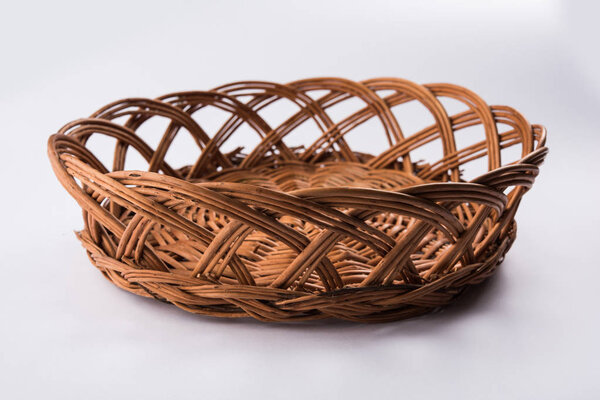 empty cane basket or tokri in hindi and topli in marathi, isolated over white background