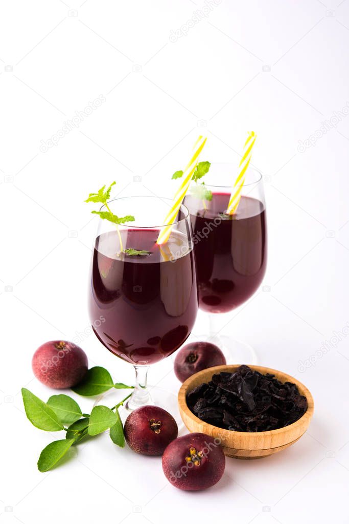 Kokum Sharbat, Juice or Sherbet OR summer coolant drink made up of Garcinia indica with raw fruit, served in a glass with mint leaf. selective focus
