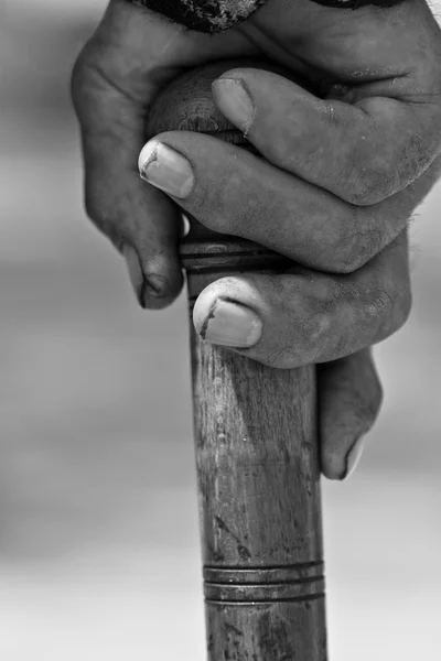 Hand Holding Wooden Walking Stick — Stock Photo © SimpleFoto #11204550