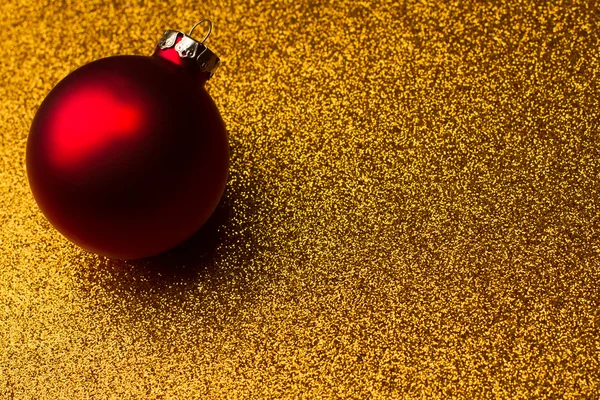 glitter altın arka plan üzerinde kırmızı Noel dekorasyon dünya