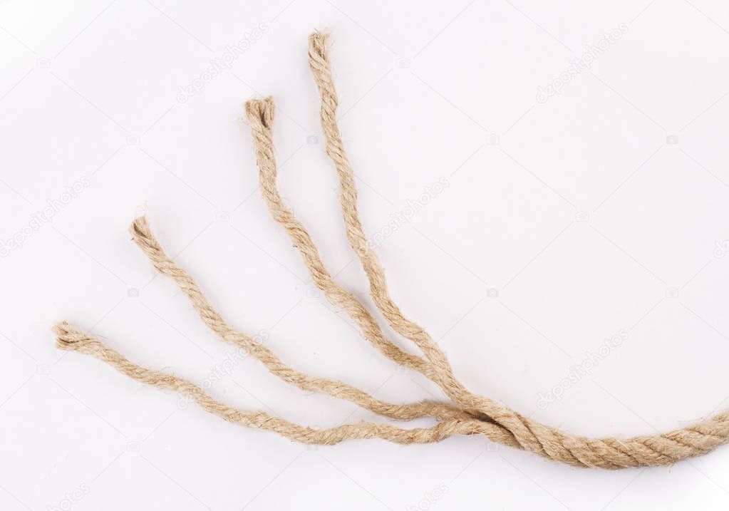 close up of unraveled rope on white