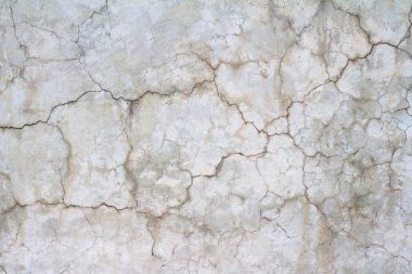 Beyaz bir beton duvar çatlakları