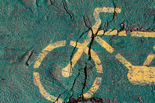 Żółty rower malowane na trasę rowerową — Zdjęcie stockowe