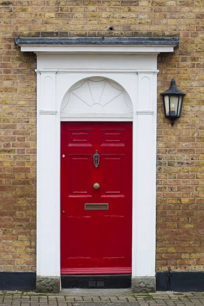 Red elegant residential apartment door — Stock Photo, Image