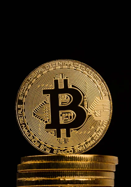 Closeup of golden bitcoin on pile of metallic coins — Stock Photo, Image