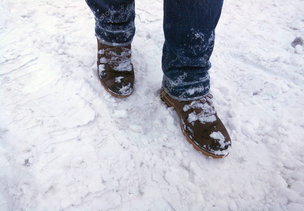 Winter shoes in the snow. Walking on snow. Danger of slipping on ice