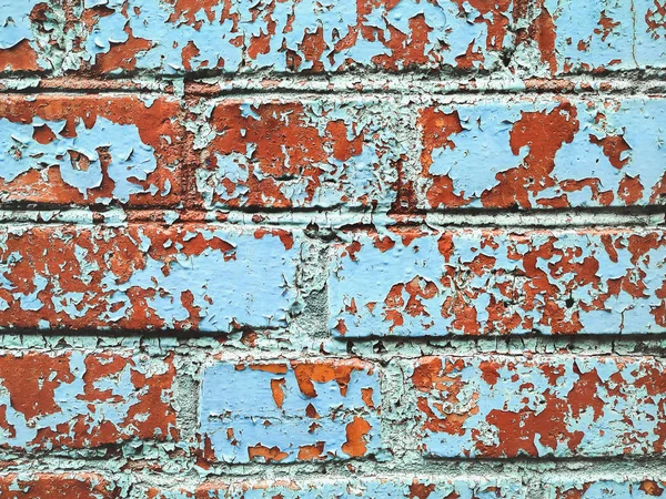 旧的纹理开裂红砖墙 旧的蓝色纹理开裂和开裂的秋天破坏 为设计而改进壁面纹理 裂开的色彩背景 — 图库照片