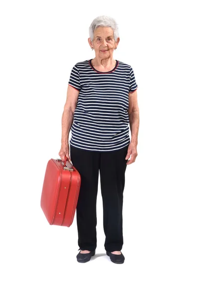 Oude dame gaat op vakantie op wit — Stockfoto