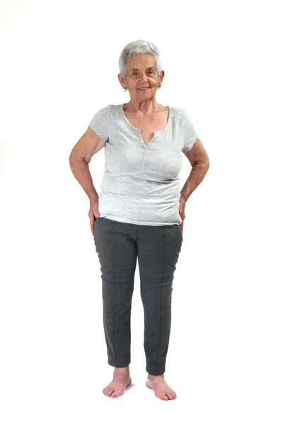 Mujer mayor ejercitando yoga aislada sobre blanco —  Fotos de Stock