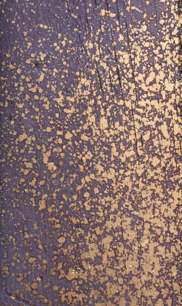 Velho violeta de madeira com respingo dourado — Fotografia de Stock