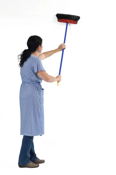 Woman sweeping on white — Stock Photo, Image