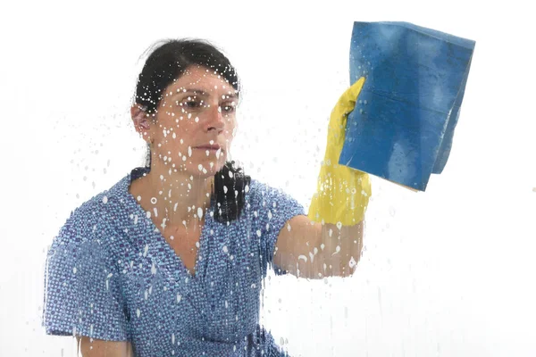 Woman cleaning glass on white — Stock Photo, Image