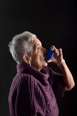 old woman with an inhaler clipart