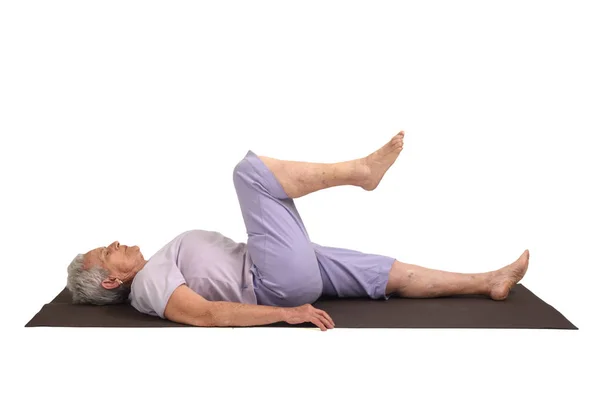 Mujer mayor haciendo yoga, aislada —  Fotos de Stock