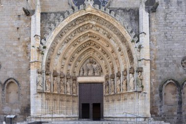 Entrance of the gothic cathedral of Santa Maria in Castello d Em clipart