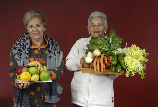 senior woman with vegetables and fruits