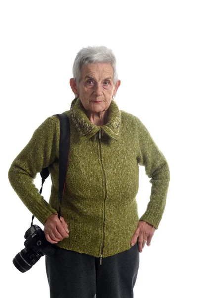 Mulher mais velha com uma câmera SLR — Fotografia de Stock