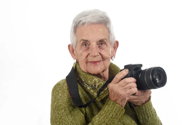Oudere vrouw met een Slr camera — Stockfoto