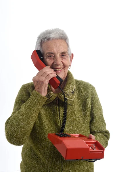 Vrouw praten over oude telefoon — Stockfoto