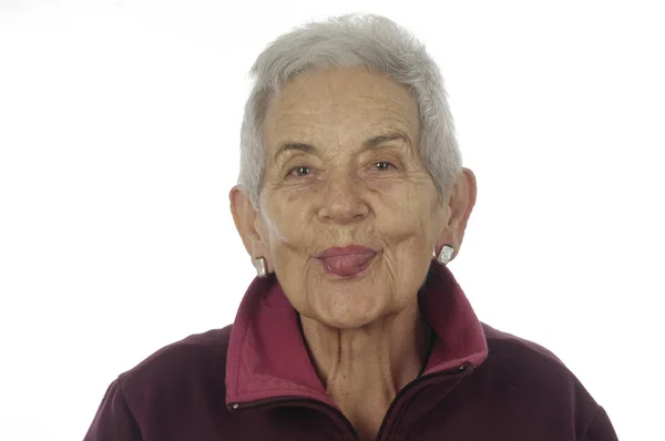 Trzymanie się język starszy Kobieta — Zdjęcie stockowe