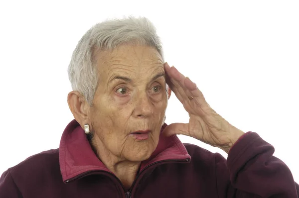 Äldre kvinna med ett uttryck av förvåning — Stockfoto