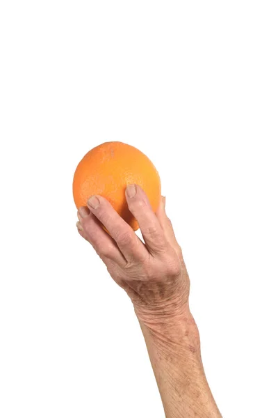 Hand der Seniorin und Orange isoliert auf Weiß — Stockfoto