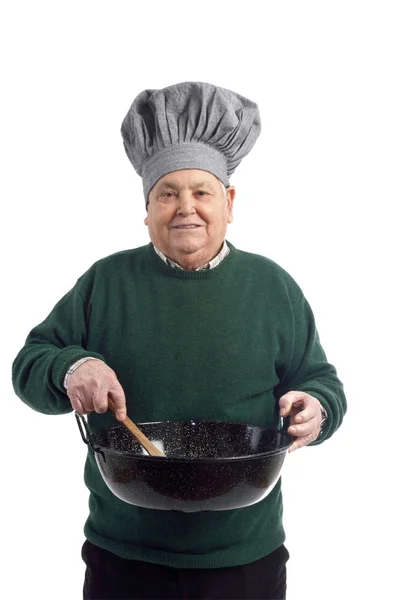 Homem sênior cozinhar em branco — Fotografia de Stock