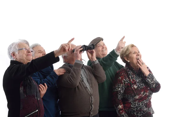 Grupp av äldste och tittar förvånad — Stockfoto