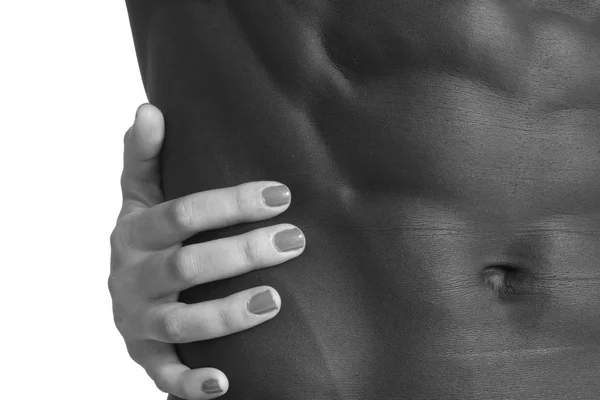 Una mano que acaricia abdominales — Foto de Stock