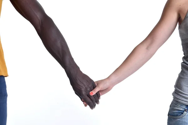 Una mano caucásica y otra africana sobre fondo blanco —  Fotos de Stock