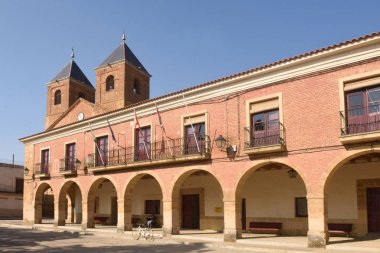 El Salvador church and town hall in Villanueva del Campo, Tierra clipart