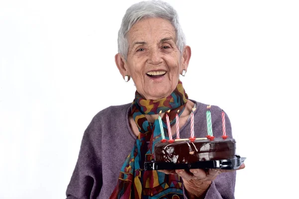 Senior mujer jugando pastel; en blanco —  Fotos de Stock
