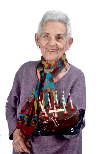 Senior woman playing cake;on white — Stock Photo, Image