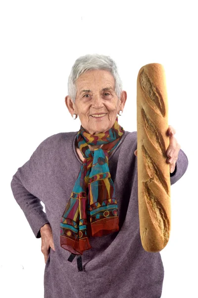Donna anziana mangiare pane su sfondo bianco — Foto Stock