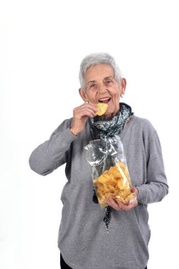 Beyaz cipsi yemek kadın kıdemli