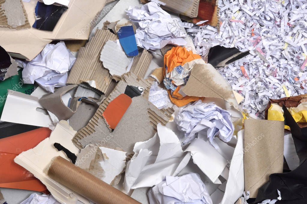 papers inside a container to be recycled,