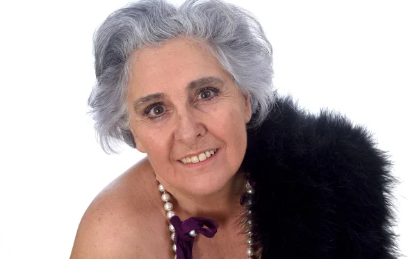 Пожилая женщина с сексуальной позой на белом фоне — стоковое фото