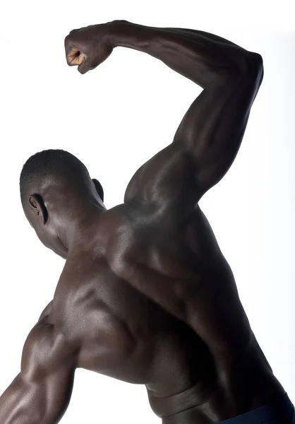 Retrato de um homem atlético preto em suas costas — Fotografia de Stock