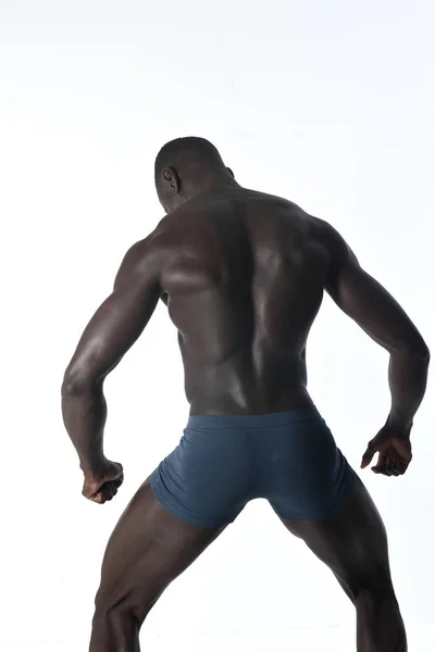 Portret van een zwarte atletische man op zijn rug — Stockfoto