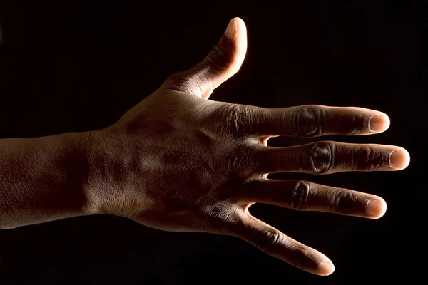 Ręka z Afrykaninem na białym — Zdjęcie stockowe