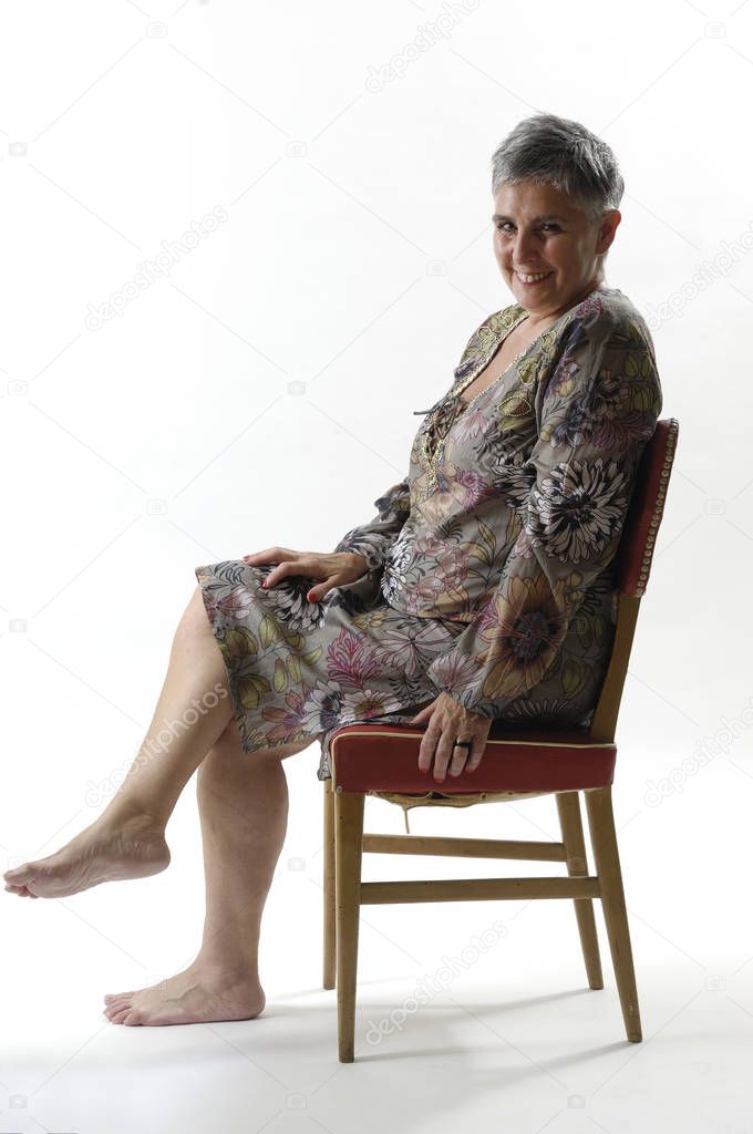 portrait of a senior woman sitting with short 