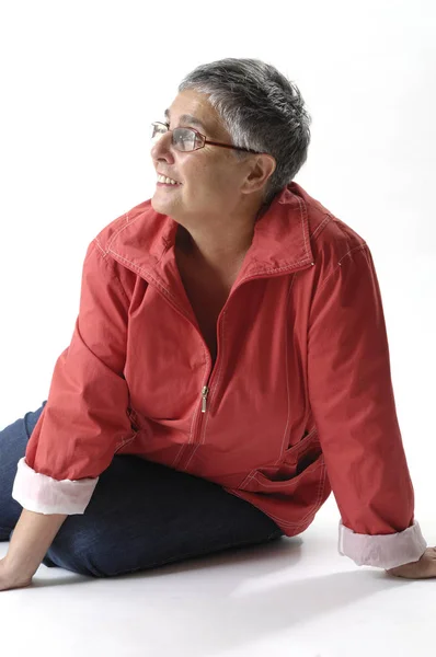 Senior mujer sentado en blanco —  Fotos de Stock